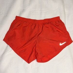 Coral Nike dry-fit running shorts
